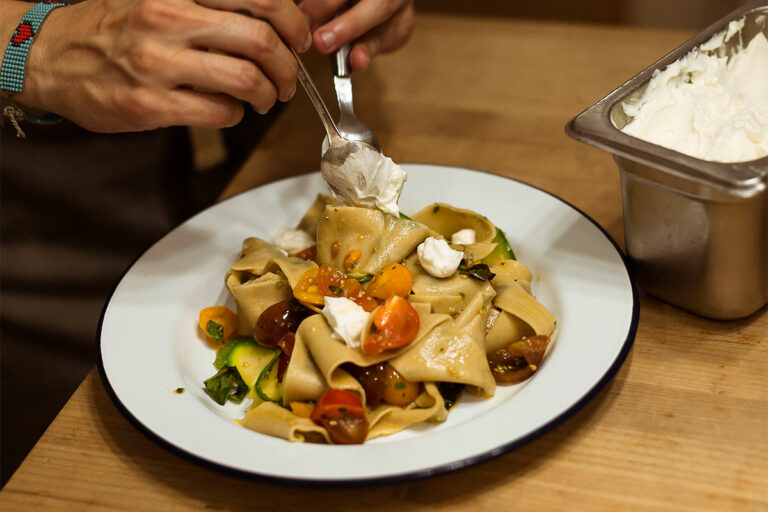 Herbed Pappardelle being served on a dish.
