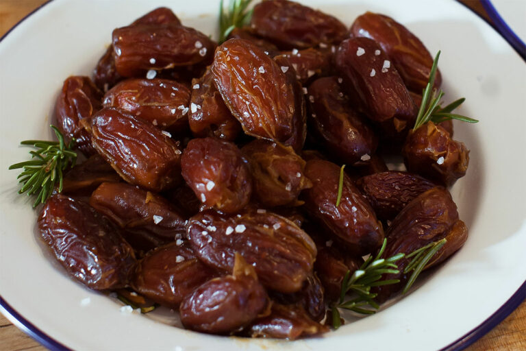 Medjool Dates with Rosewater, Rosemary, and Sea Salt on a platter.