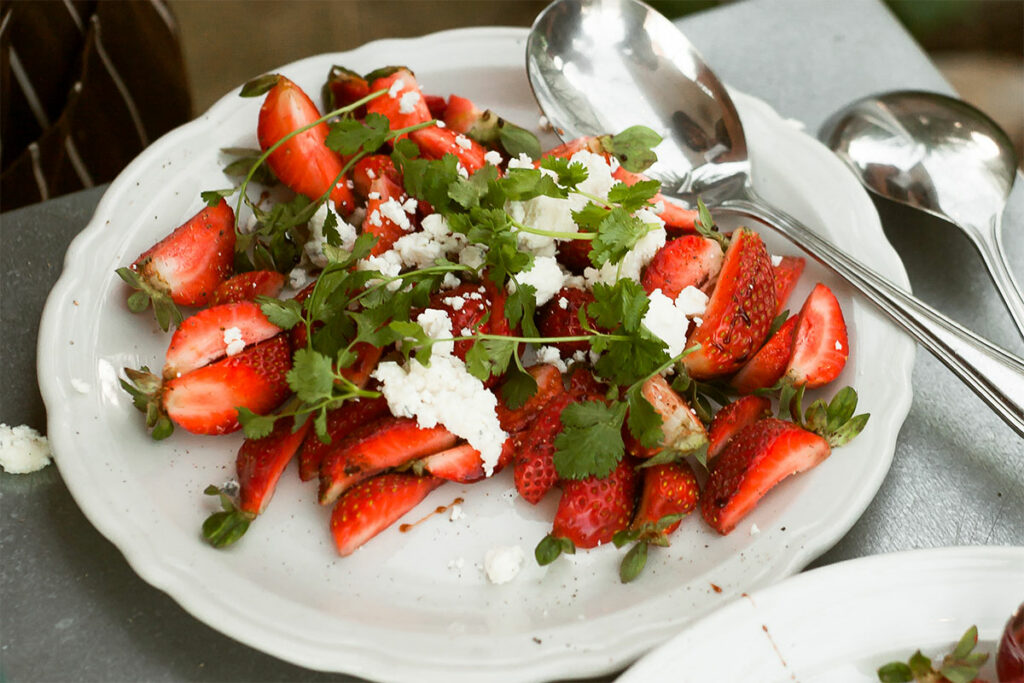 Strawberry & Goat Cheese Salad on a plate.